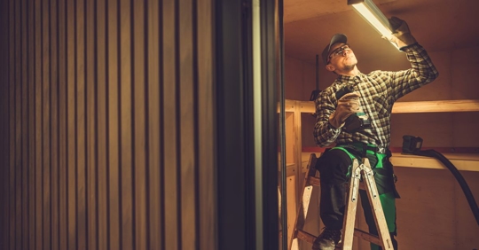 man installing LED fixture